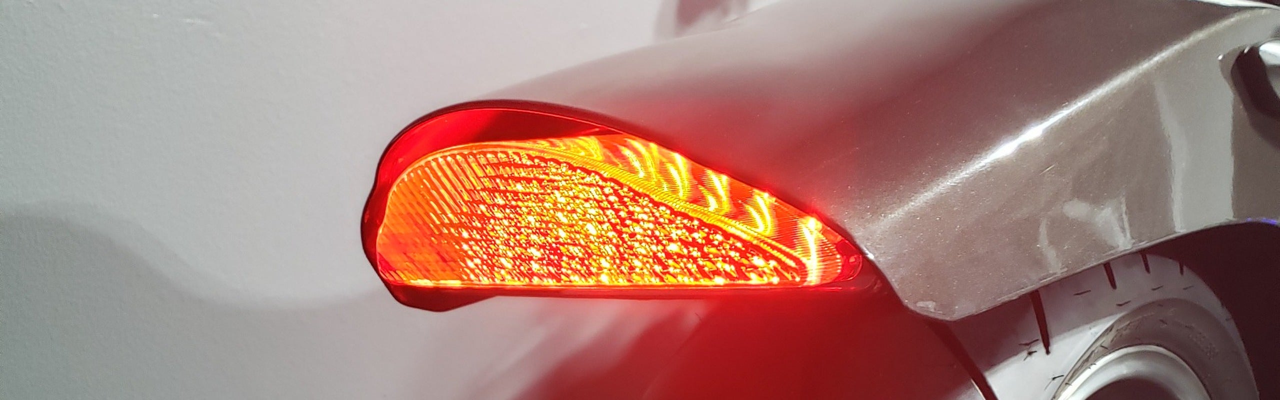 Blaster-X LED tail light glowing bright red on a Yamaha Warrior